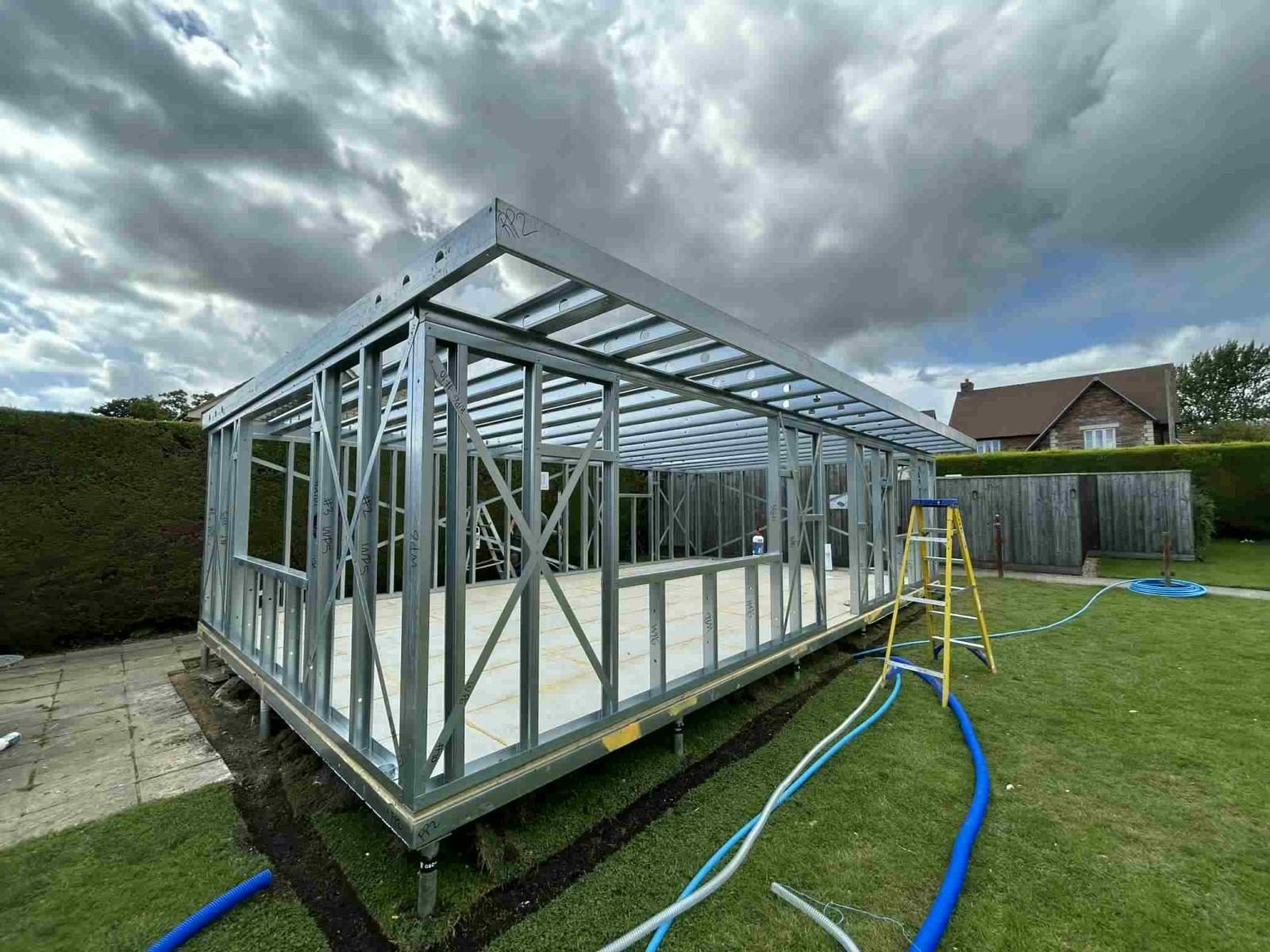 Steel frame on the prepared base — JLG Construction Services