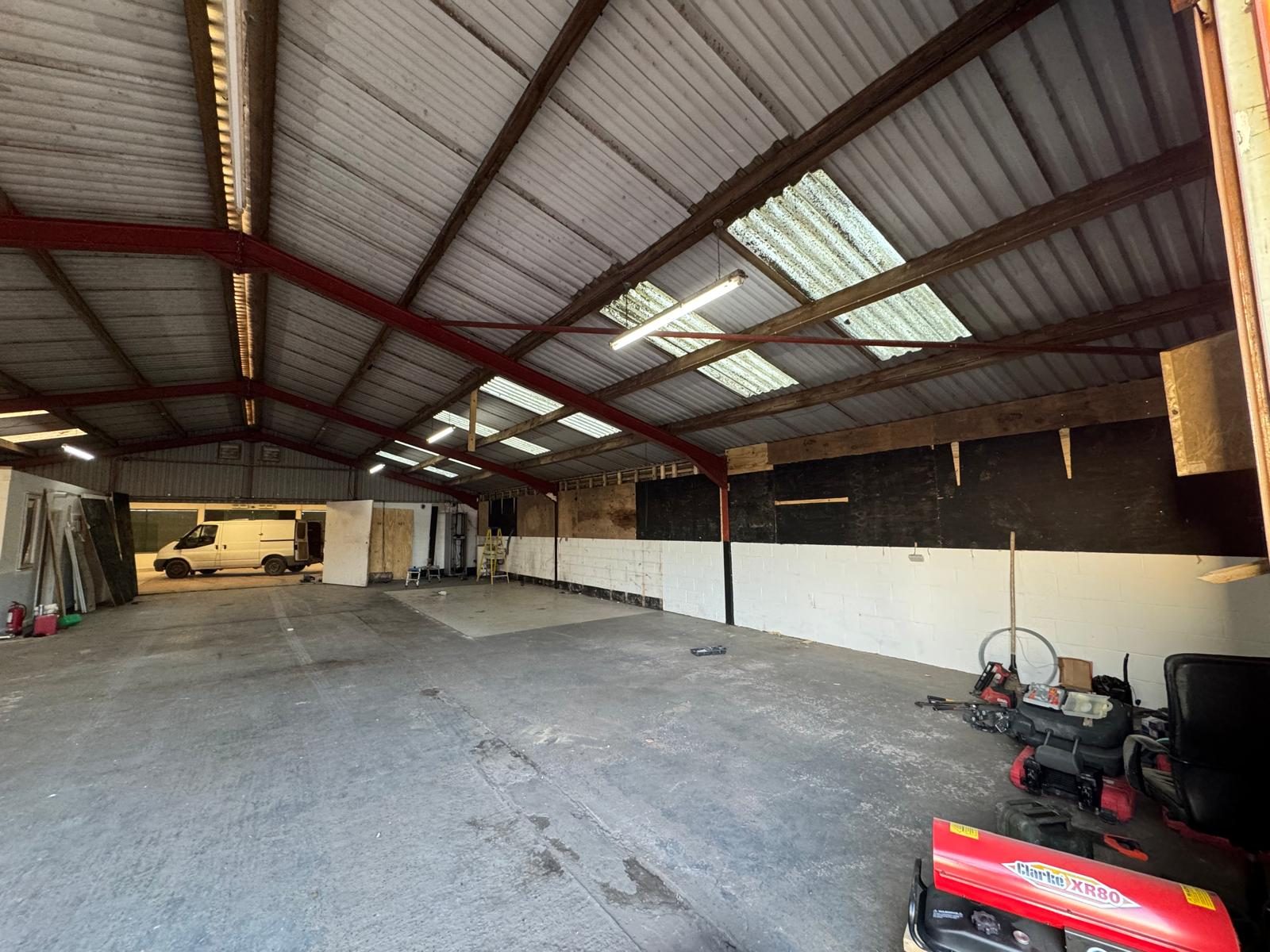 Stripped shell under the original roof, HM Car Sales, JLG Construction Services