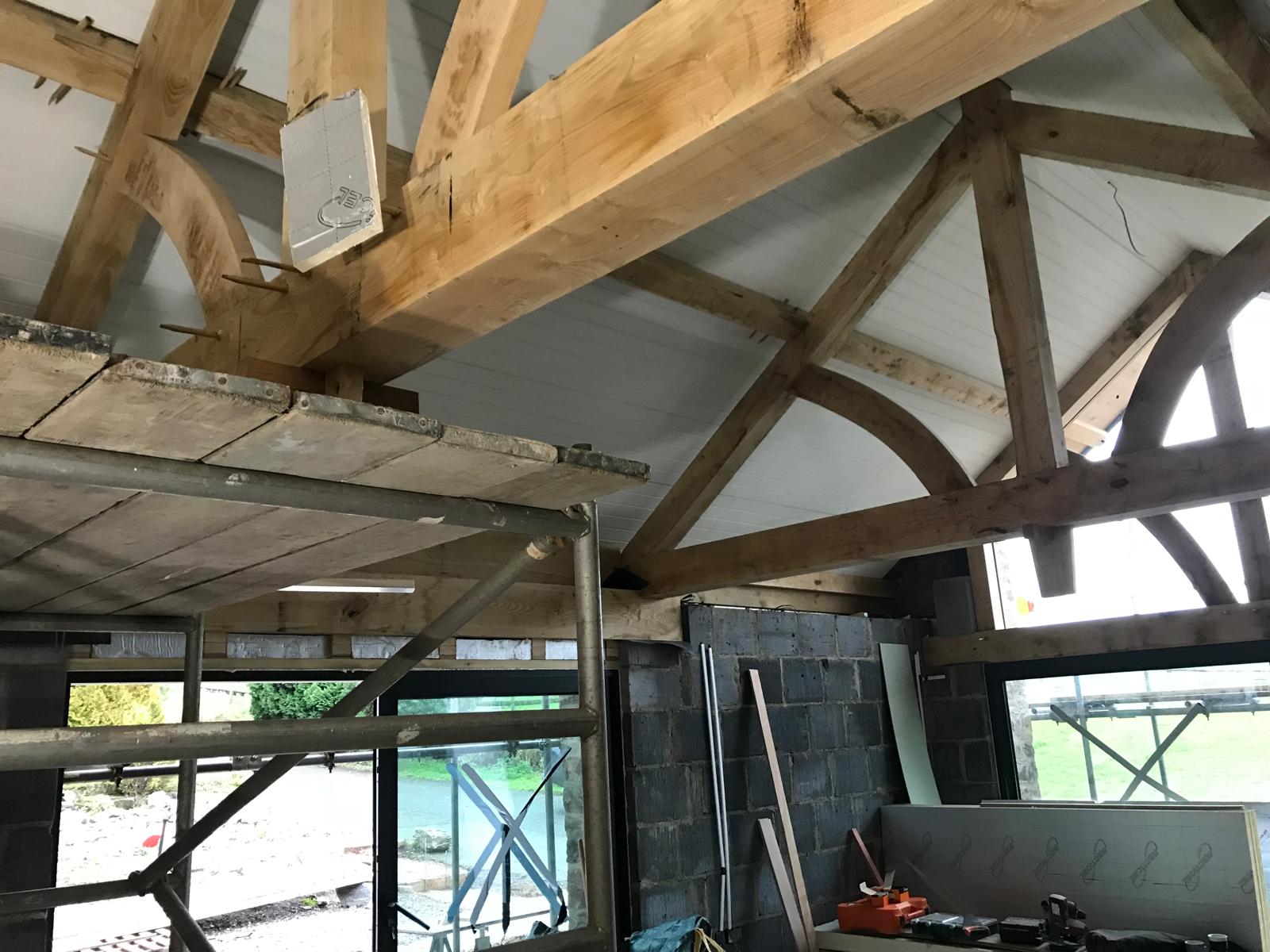 Oak trusses and glazed doors during the fit-out, Oak-Framed Farmhouse Extension, JLG Construction Services