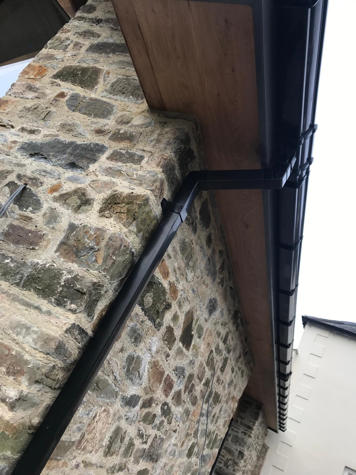 Guttering and downpipes on the finished stonework, Oak-Framed Farmhouse Extension, JLG Construction Services