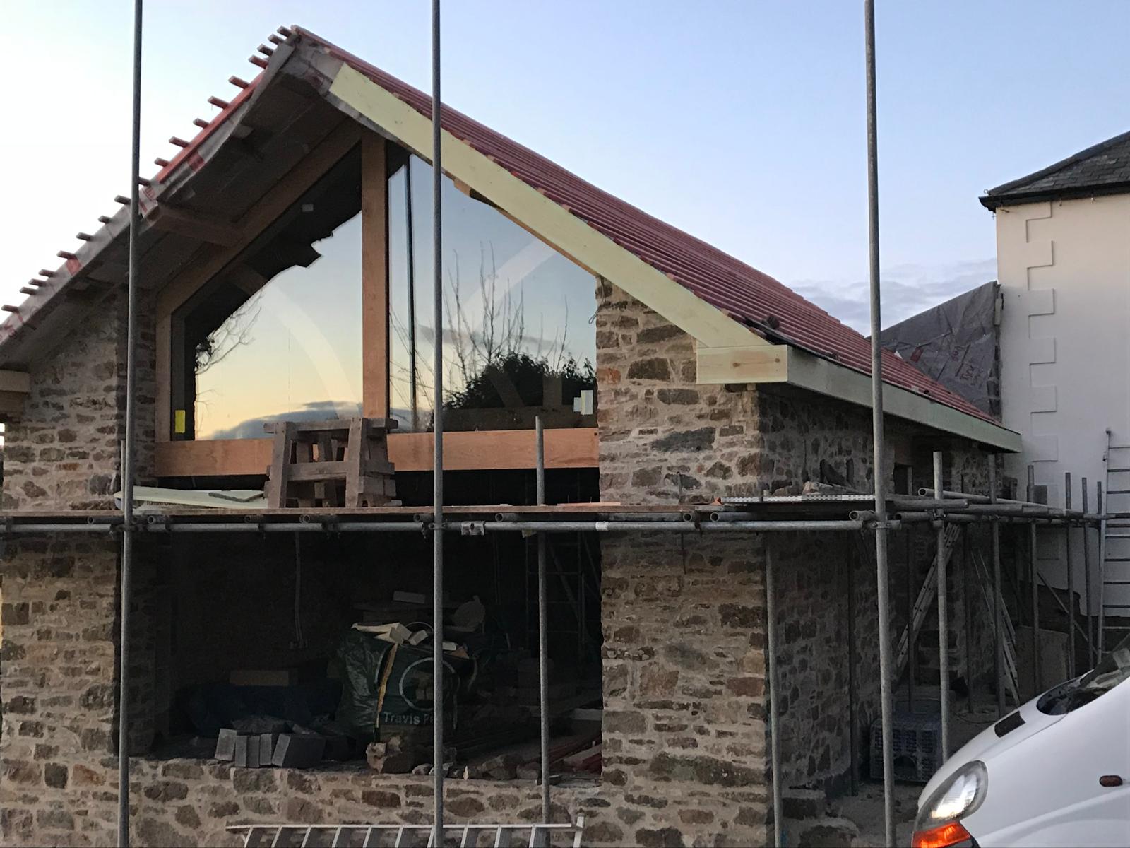 The glazed oak gable before the roof covering went on, Oak-Framed Farmhouse Extension, JLG Construction Services