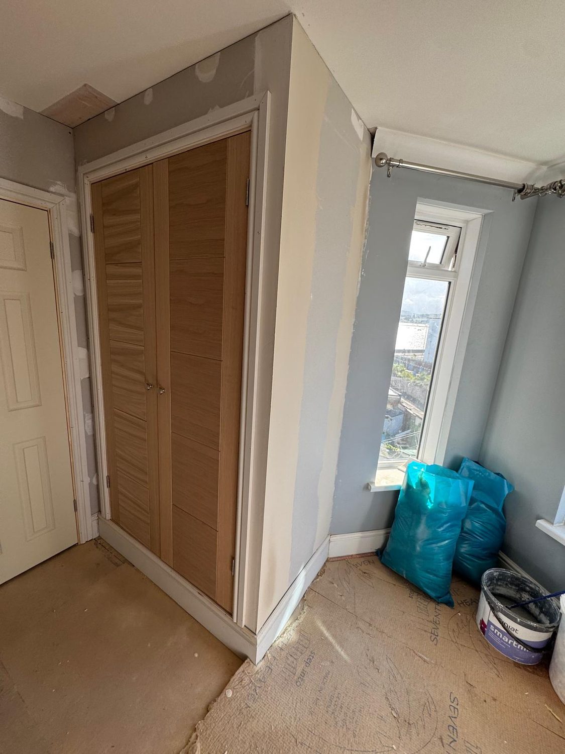 Built-in wardrobe fitted into the bay-window bedroom, JLG Construction Services