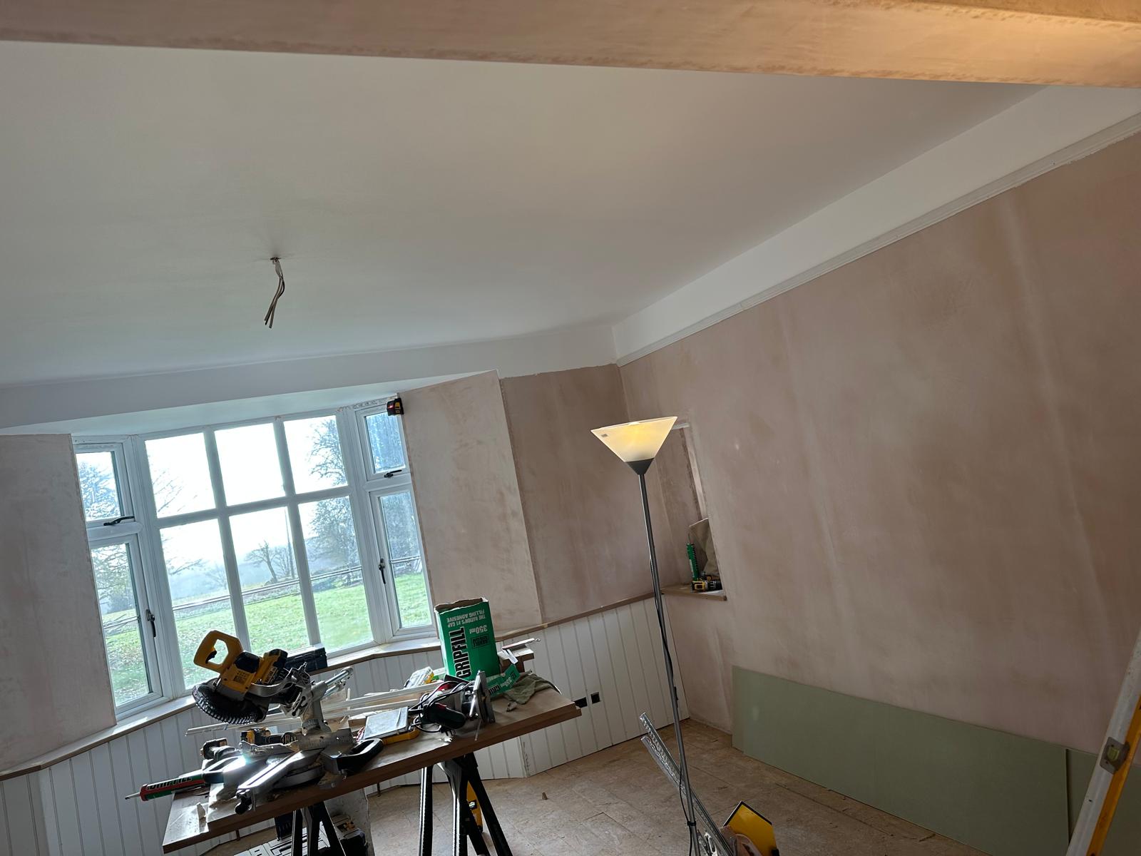 Skimmed out, original beam and new panelling below the bay, Stoodleigh Cottage Renovation, JLG Construction Services