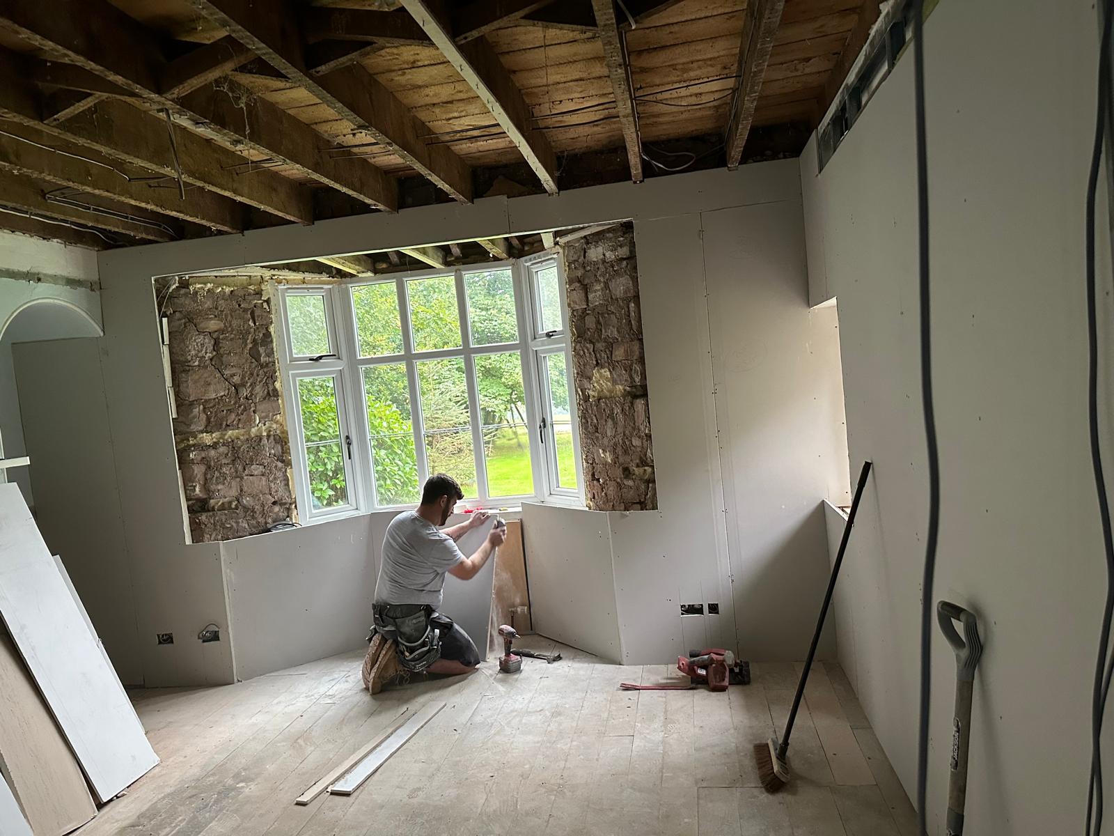 Insulated plasterboard going in at the bay window, Stoodleigh Cottage Renovation, JLG Construction Services