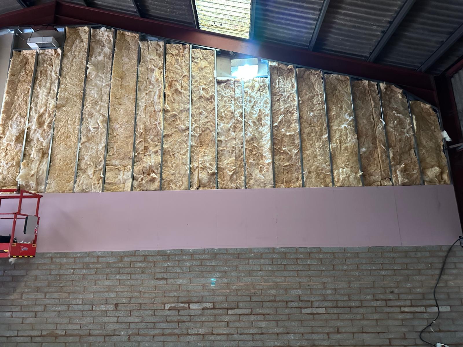 Insulation fitted between the jumbo studs, Wellington Industrial Units, JLG Construction Services