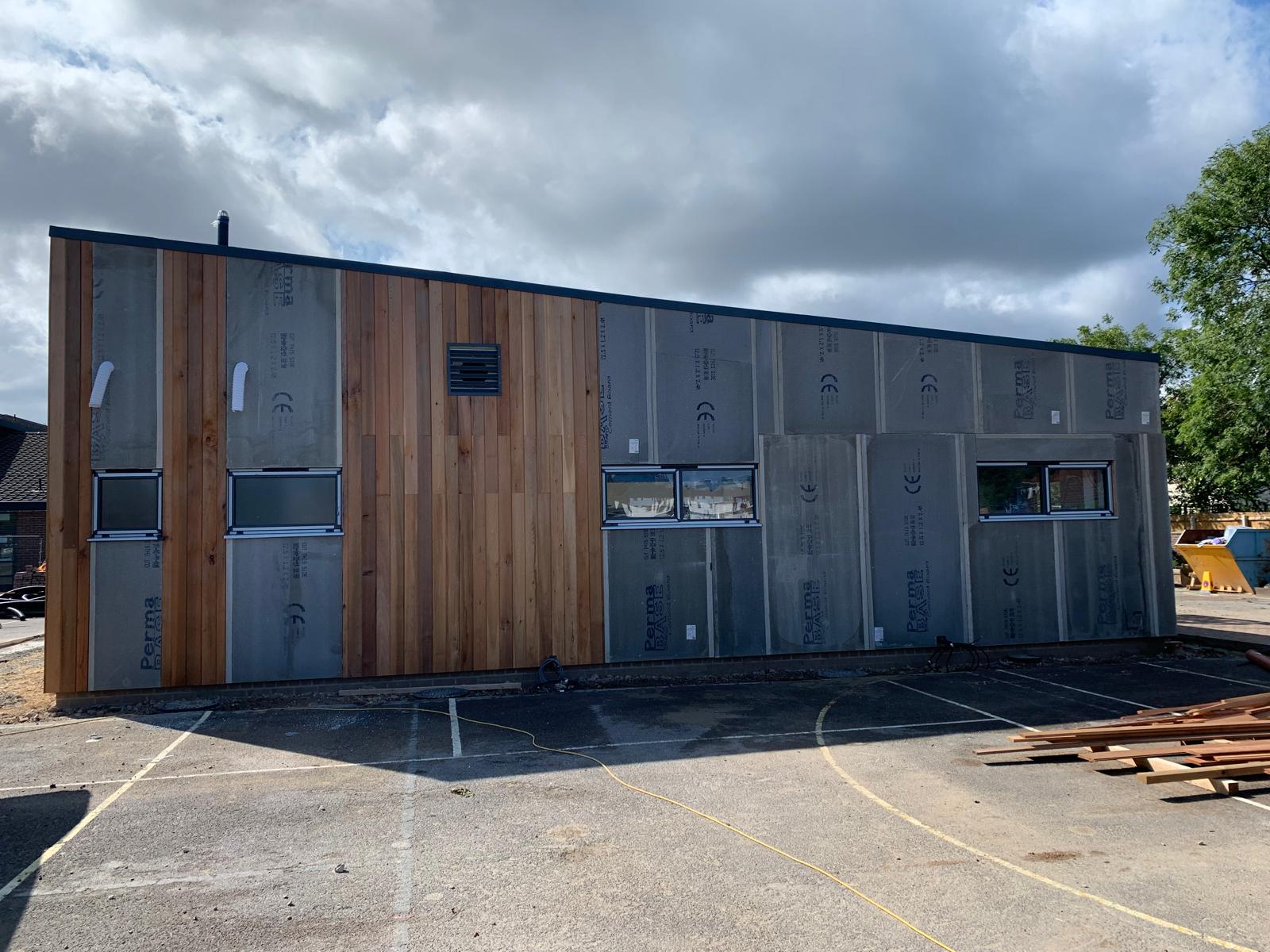 The boarded elevation, timber cladding working across, Wimborne School, JLG Construction Services