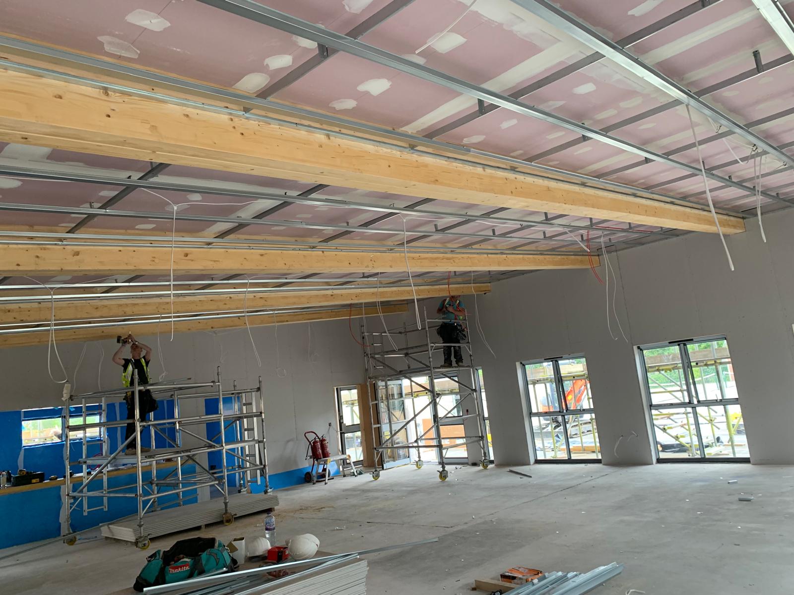 Fire-rated boarding overhead, MF grid going in, Wimborne School, JLG Construction Services